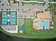 Aerial view of community amenities, including tennis courts, pool, and lush landscaping at 13872 Rinuccio St, Venice, FL 34293