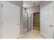 Bathroom featuring glass-enclosed shower and access to walk-in closet at 13872 Rinuccio St, Venice, FL 34293