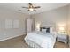 Cozy bedroom with ceiling fan, and comfortable furnishings at 13872 Rinuccio St, Venice, FL 34293