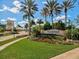 Beautiful Islandwalk community entrance with lush landscaping, signage and manicured lawns at 13872 Rinuccio St, Venice, FL 34293