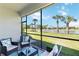 Inviting screened lanai offering picturesque water views and comfortable seating area at 13872 Rinuccio St, Venice, FL 34293