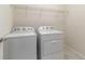 Convenient laundry room featuring a washer, dryer, and overhead storage shelf at 13872 Rinuccio St, Venice, FL 34293