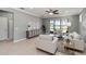 Inviting living room with tiled floors, neutral decor, and a view to a lake at 13872 Rinuccio St, Venice, FL 34293