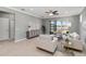 Inviting living room with tiled floors, neutral decor, and a view to a lake at 13872 Rinuccio St, Venice, FL 34293