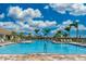 Resort-style swimming pool with ample lounge seating, perfect for relaxation and recreation at 13872 Rinuccio St, Venice, FL 34293
