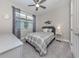 Comfortable bedroom featuring a window with blinds, and gray carpet at 149 Vinadio Blvd, Nokomis, FL 34275
