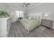 Comfortable bedroom with neutral walls, a ceiling fan, and lots of natural light at 149 Vinadio Blvd, Nokomis, FL 34275