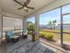 Inviting lanai with comfortable seating and scenic lake views with lots of natural light at 149 Vinadio Blvd, Nokomis, FL 34275