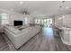 Open-concept living space with modern finishes, natural light, and seamless access to the lanai at 149 Vinadio Blvd, Nokomis, FL 34275