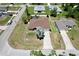 Aerial view of home with mature landscaping, concrete driveway, and surrounding neighborhood at 1510 Haffenberg Ave, North Port, FL 34288