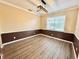 This dining room features chair-rail detail, modern light fixture, and a window overlooking the front yard at 1510 Haffenberg Ave, North Port, FL 34288