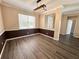 Dining area with wainscoting and a modern light fixture at 1510 Haffenberg Ave, North Port, FL 34288