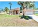 Charming single-story home with a well-manicured lawn and attached two-car garage at 1510 Haffenberg Ave, North Port, FL 34288