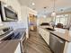 Gourmet kitchen with stainless steel appliances, an island with bar seating, and a stylish backsplash at 1510 Haffenberg Ave, North Port, FL 34288