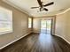 Bright, open living room with wood floors and sliding doors to a screened patio at 1510 Haffenberg Ave, North Port, FL 34288