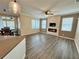 Living room boasts a stone accent wall with fireplace and opens to the kitchen and dining areas at 1510 Haffenberg Ave, North Port, FL 34288