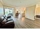 Living room with views of kitchen, dining area, and back patio with sliding glass doors at 1510 Haffenberg Ave, North Port, FL 34288