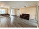 Open-concept living room featuring wood floors, neutral paint, and modern accents at 1510 Haffenberg Ave, North Port, FL 34288