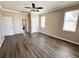 Spacious living room featuring hardwood floors, neutral walls and natural light at 1510 Haffenberg Ave, North Port, FL 34288