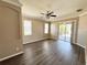 Bright, open living room with wood floors and sliding doors to a screened patio at 1510 Haffenberg Ave, North Port, FL 34288