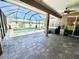 Expansive covered patio featuring a hot tub and access to the screened pool area at 1510 Haffenberg Ave, North Port, FL 34288