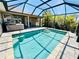 Lovely screened pool and hot tub area with access from inside the home at 1510 Haffenberg Ave, North Port, FL 34288