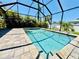 Beautiful screened pool with a brick paver deck is perfect for outdoor entertainment at 1510 Haffenberg Ave, North Port, FL 34288