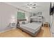 A bedroom showcases a full bed, bunk bed, fan, and bedside tables at 1629 Siesta Dr, Sarasota, FL 34239