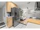 A kitchen area shows stainless steel appliances and an adjacent sitting room at 1629 Siesta Dr, Sarasota, FL 34239