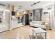Open floor plan connecting the living area to the kitchen with hardwood floors and ample space at 1629 Siesta Dr, Sarasota, FL 34239
