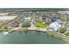 Panoramic aerial view of the Primary-planned community, highlighting homes, amenities, and the scenic lakefront at 17324 Sandpearl Rd, Venice, FL 34293