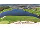 Expansive aerial shot of a community golf course and lake, surrounded by homes at 17324 Sandpearl Rd, Venice, FL 34293