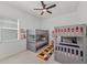 A bedroom with two bunkbeds and a ceiling fan at 17324 Sandpearl Rd, Venice, FL 34293