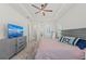 Spacious bedroom with a king bed, a ceiling fan, and recessed lighting at 17324 Sandpearl Rd, Venice, FL 34293