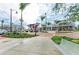 Attractive streetscape featuring retail spaces, palm trees, and pedestrian-friendly walkways at 17324 Sandpearl Rd, Venice, FL 34293