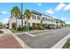 Beautiful commercial building with a stucco facade, awnings, and lush landscaping at 17324 Sandpearl Rd, Venice, FL 34293