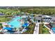 Aerial view showcasing the community pool, clubhouse, and lush landscaping at 17324 Sandpearl Rd, Venice, FL 34293