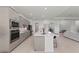Beautiful kitchen with a spacious island, modern appliances, and a seamless flow to living areas at 17324 Sandpearl Rd, Venice, FL 34293