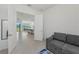 Open-concept living room and dining area with tile floors and view to the dining table and outdoor space at 17324 Sandpearl Rd, Venice, FL 34293