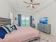 Cozy main bedroom with ceiling fan, neutral décor, and balcony access at 17324 Sandpearl Rd, Venice, FL 34293