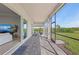 Inviting covered patio with a seamless transition to the outdoors and sunny backyard at 17324 Sandpearl Rd, Venice, FL 34293