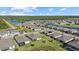 Picturesque aerial view of a neighborhood near a lake, showcasing the peaceful community and surrounding natural landscape at 2000 Gardenia Ave, Port Charlotte, FL 33953
