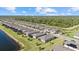 Spacious community aerial view of single Gathering homes with water views and manicured landscaping, offering comfortable living at 2000 Gardenia Ave, Port Charlotte, FL 33953