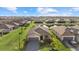Aerial view of a neighborhood highlighting a home with lush landscaping and beautiful surroundings at 2000 Gardenia Ave, Port Charlotte, FL 33953