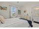 Bright bedroom with a view to the bathroom, featuring neutral walls and elegant decor at 2000 Gardenia Ave, Port Charlotte, FL 33953