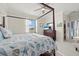 Bedroom with a four-poster bed and a view of the lush green outdoors at 2000 Gardenia Ave, Port Charlotte, FL 33953