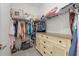 Walk-in closet with organized shelving, clothing racks, and a dresser for ample storage at 2000 Gardenia Ave, Port Charlotte, FL 33953