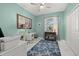 Bright home office featuring stylish decor, a ceiling fan, and lots of natural light at 2000 Gardenia Ave, Port Charlotte, FL 33953