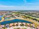 Beautiful aerial view of a community surrounded by lakes and lush greenery, highlighting the prime location at 20126 Elegante Ct, Venice, FL 34293