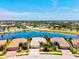 Beautiful aerial view of this home, community amenities and lake in a desirable neighborhood at 20126 Elegante Ct, Venice, FL 34293